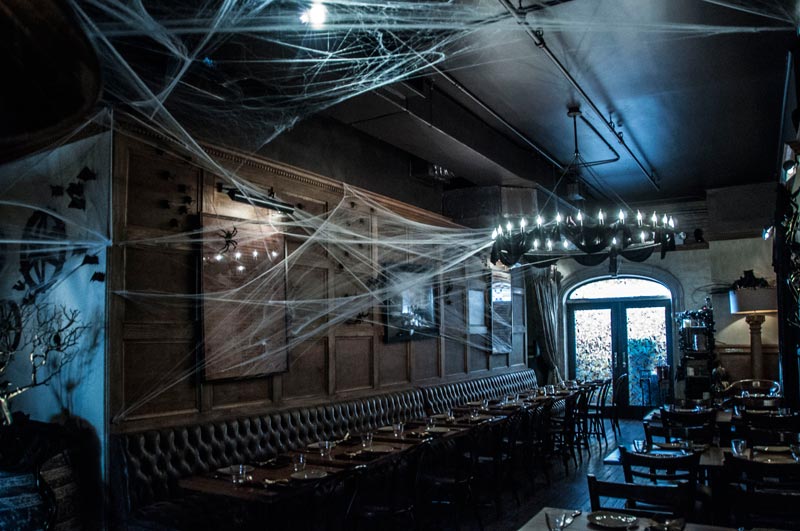 image of halloween decor at the greek restaurant - by Anastasios Interiors